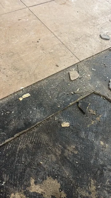 Black bitumen mastic floor removal in a SE17 flat